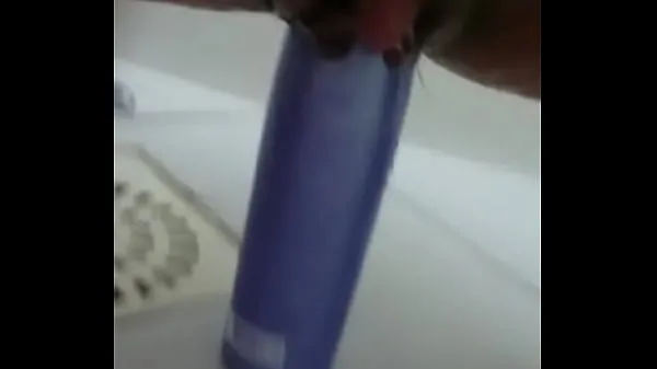Big Stuffing the shampoo into the pussy and the growing clitoris new Videos
