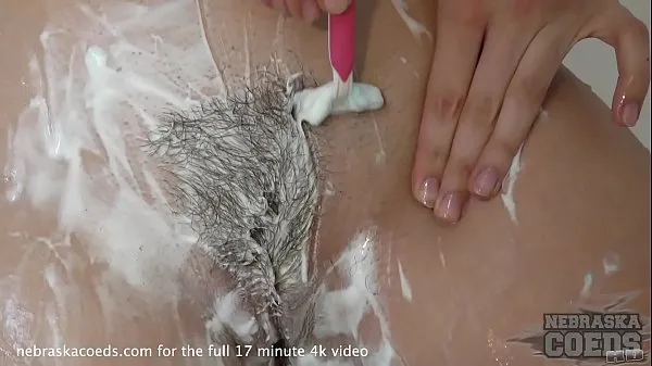 22yo blonde lucia shaving her hairy pussy then glass dildo shower masturbate مقاطع فيديو جديدة كبيرة