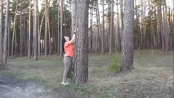 Store A milf with big tits and a juicy PAWG undresses in the forest and masturbates her pussy with a spruce branch. Merging with the nature of a mature nudist. Outdoor amateur fetish nye videoer